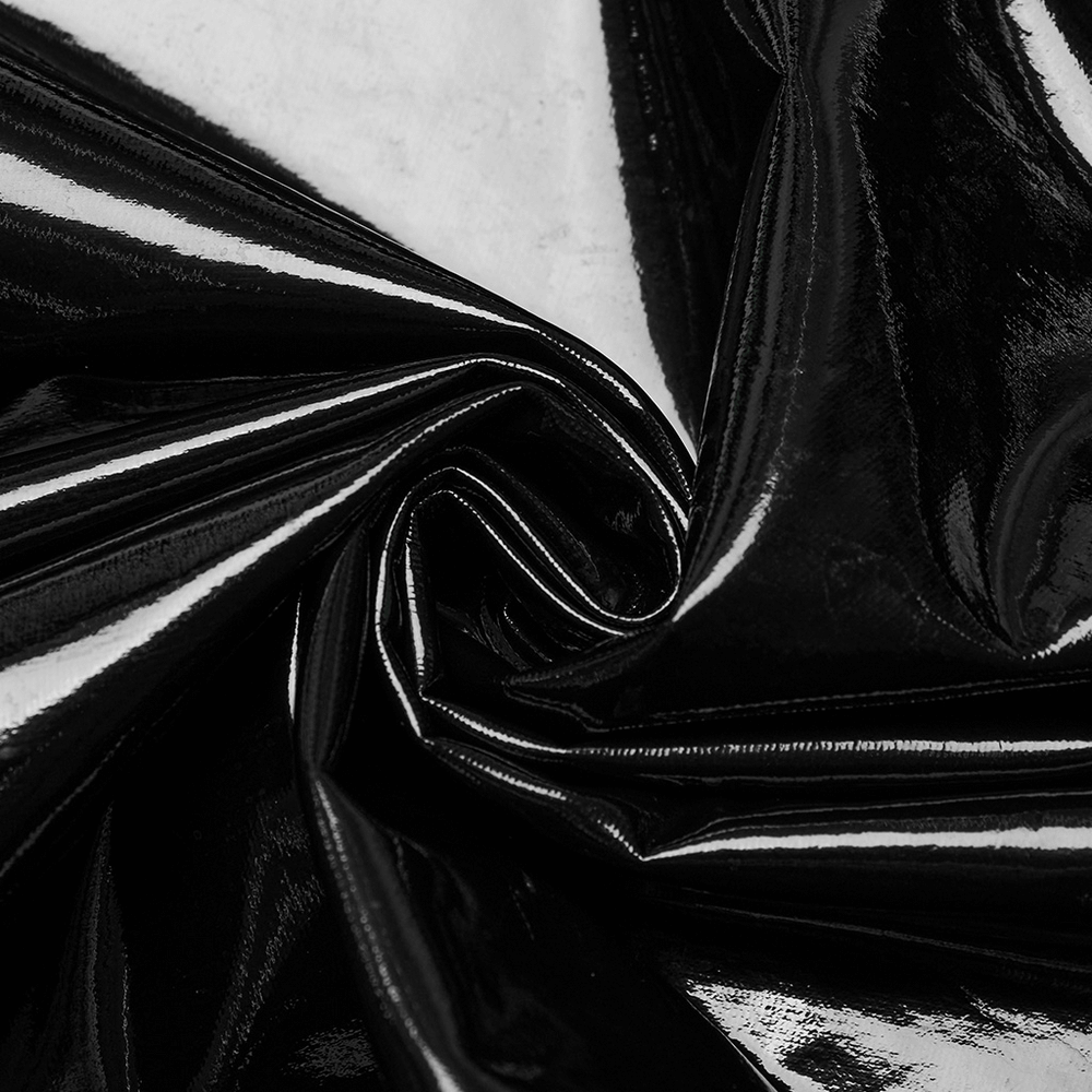 Close-up of sleek black faux leather fabric, glossy and textured for a sexy punk dress design.