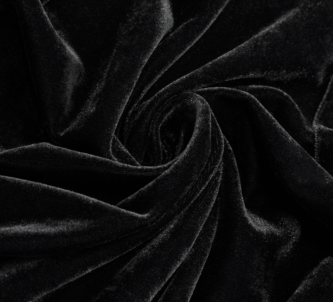 Close-up of luxurious black velvet fabric, showcasing a soft and elegant texture perfect for gothic fashion.