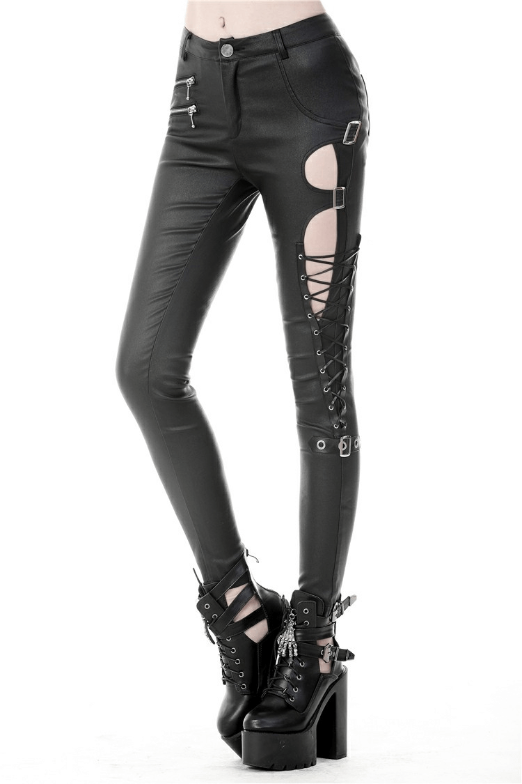 Edgy black skinny pants with cutout sides and lace-up detailing, perfect for a punk-rock style.