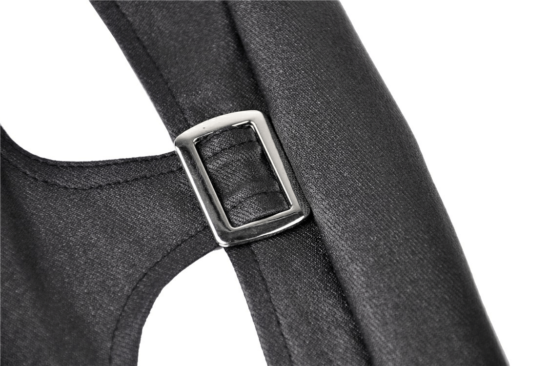 Close-up of metal hasp closure on dark gothic skinny pants with cutout side.