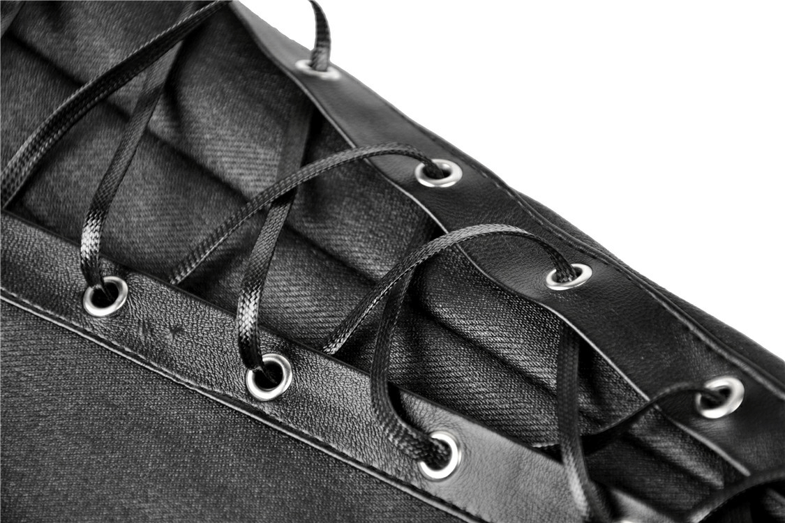 Close-up of black lace-up detailing on sexy asymmetrical skinny pants, showcasing edgy punk style.