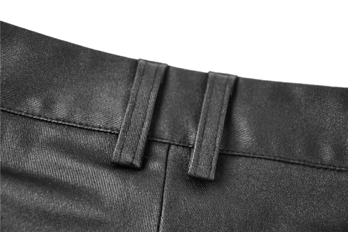 Close-up of the high-waisted waistline on sexy asymmetrical skinny pants with chic side lacing details.