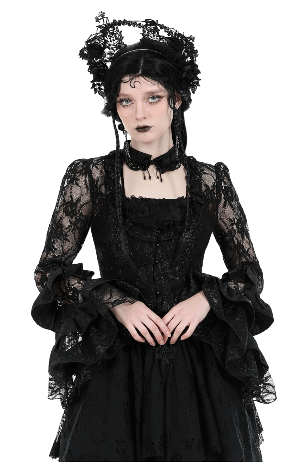Gothic-inspired woman in a sexy black lace top with elegant bell sleeves and intricate details, perfect for evening wear.
