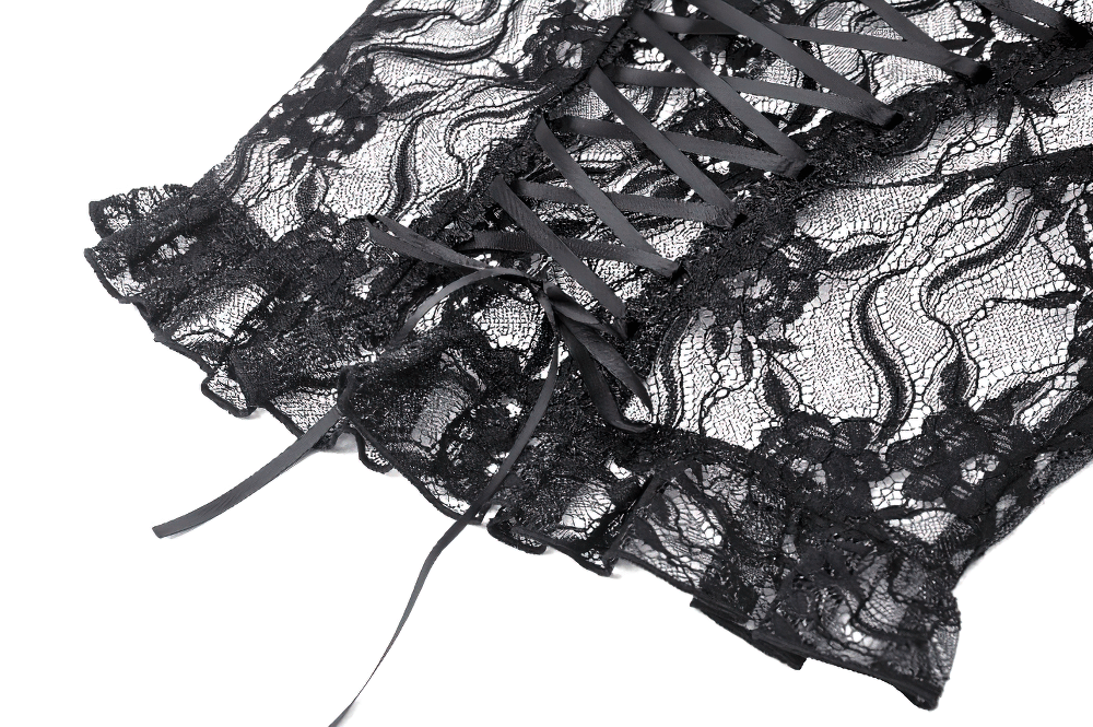 Close-up of elegant black lace with intricate patterns and lacing detail, perfect for gothic-inspired evening wear.