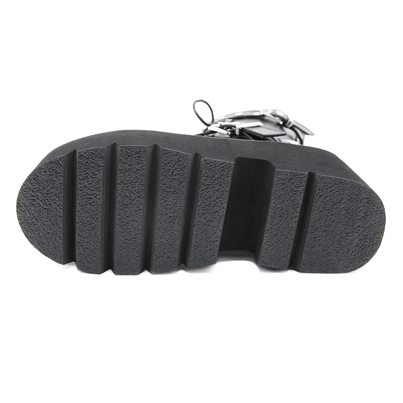 Bottom view of sexy black PU leather women's combat boots featuring a sturdy platform sole with deep grooves.