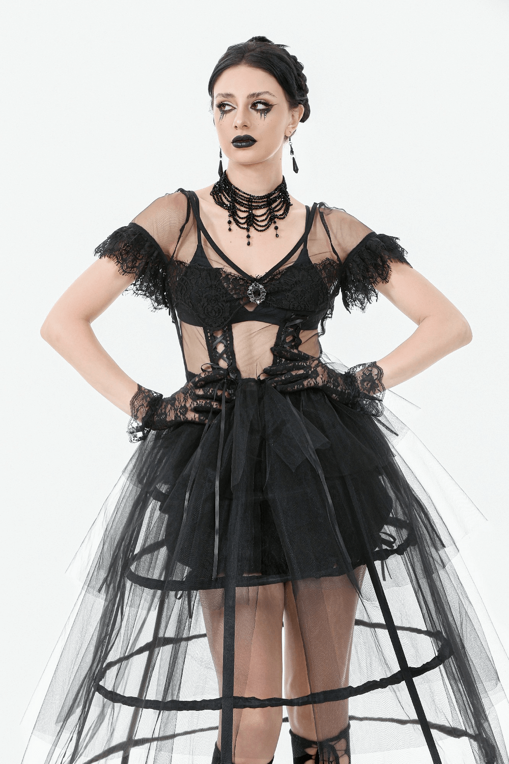Gothic black tulle dress with lace accents and layered skirt, perfect for dramatic evening wear.