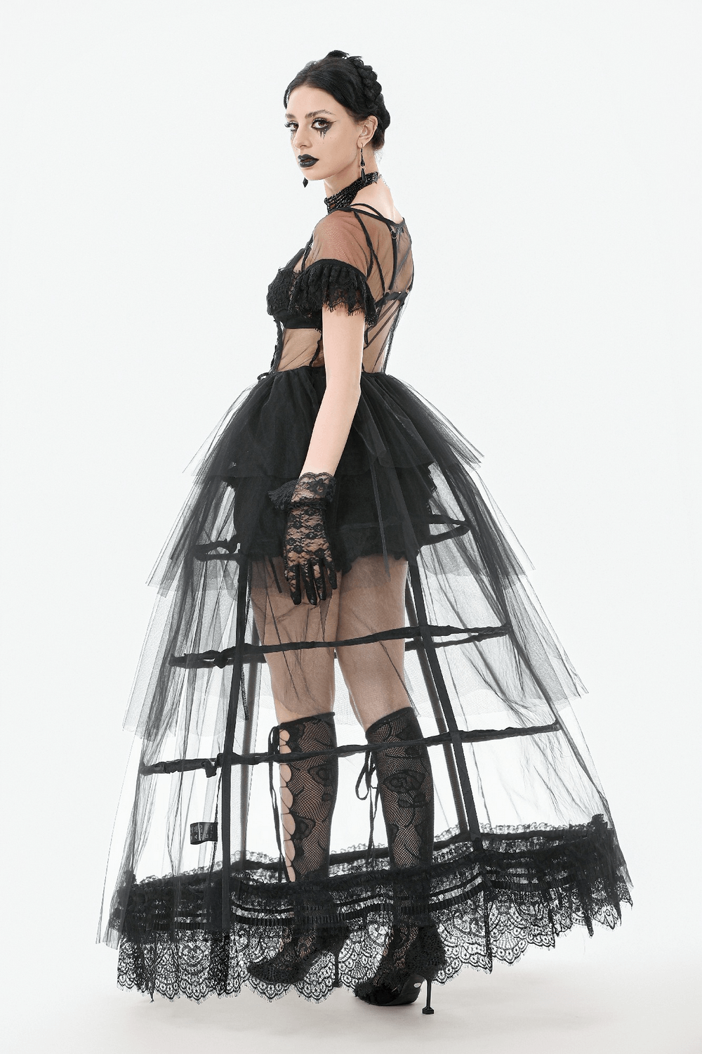 Gothic black tulle dress with lace details, showcasing a tiered skirt and dramatic silhouette.