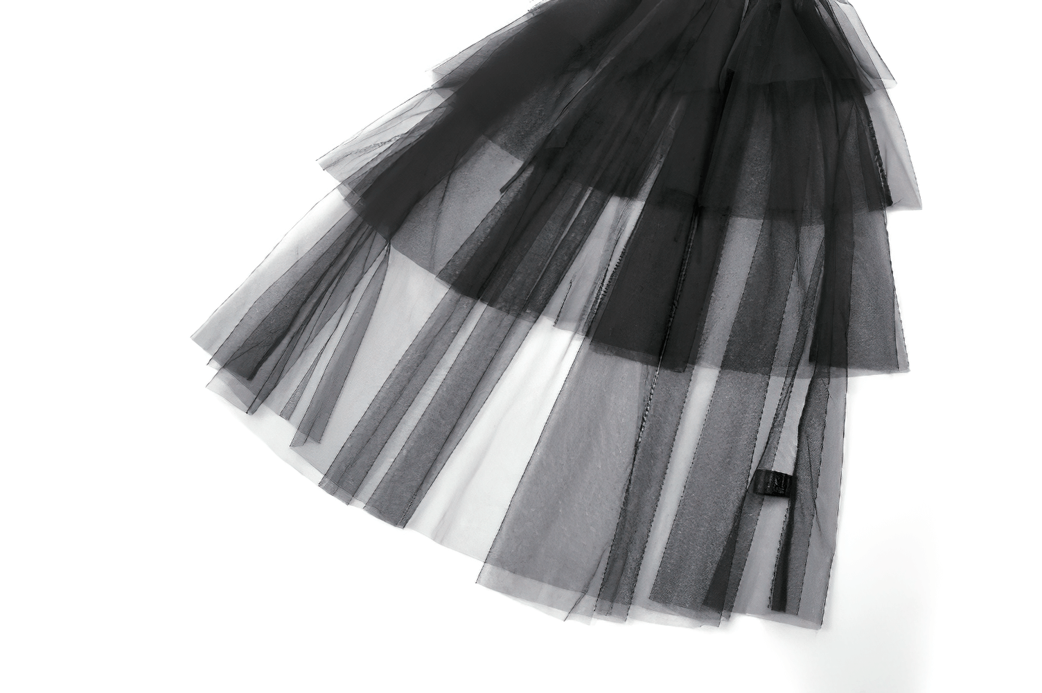 Layered black tulle skirt with translucent fabric showcasing gothic elegance and style.