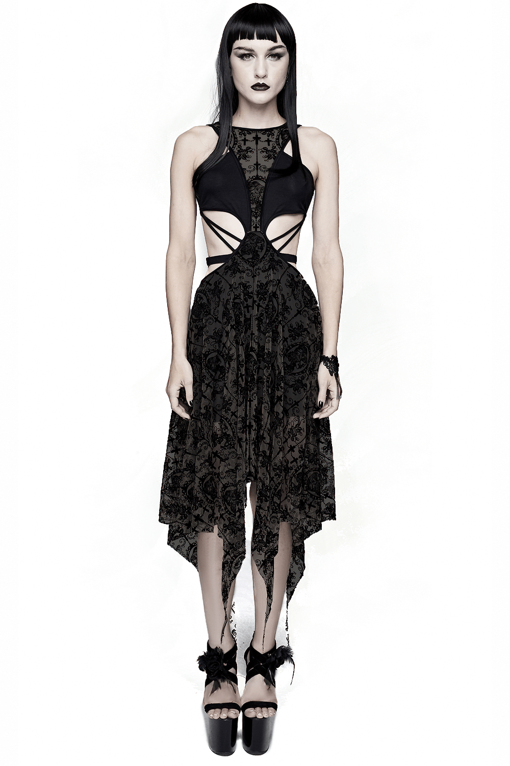 Gothic black vintage dress with asymmetrical cut and metal hearts on straps, perfect for edgy fashion lovers.