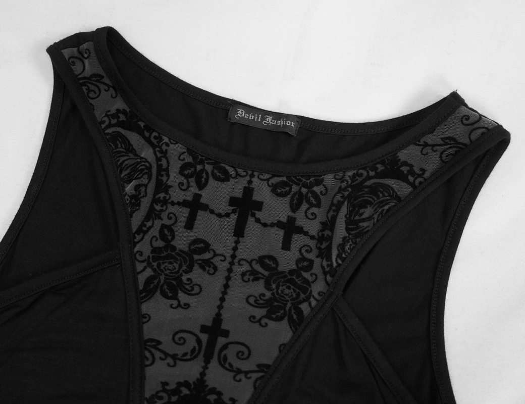 Close-up of a black gothic dress featuring intricate vintage patterns and a cross design on the bodice.