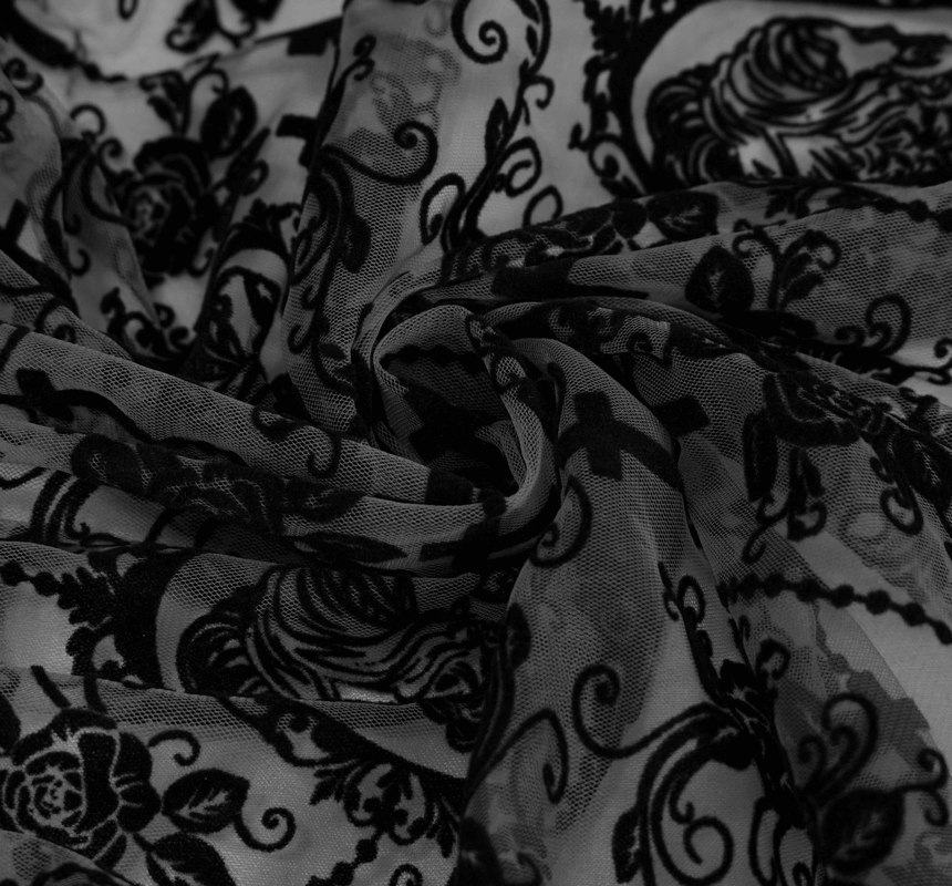 Close-up of black vintage floral pattern fabric, perfect for gothic dress designs.