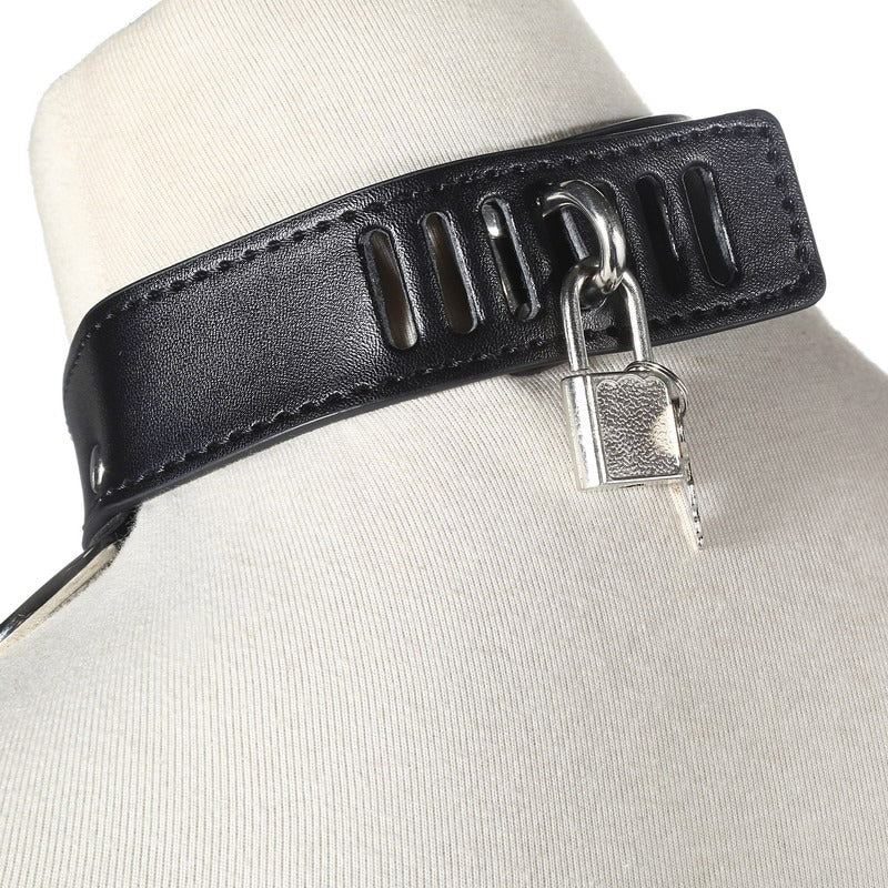 Close-up of a black leather chest harness with a silver lock, ideal for Gothic fashion and sexy alternative outfits.