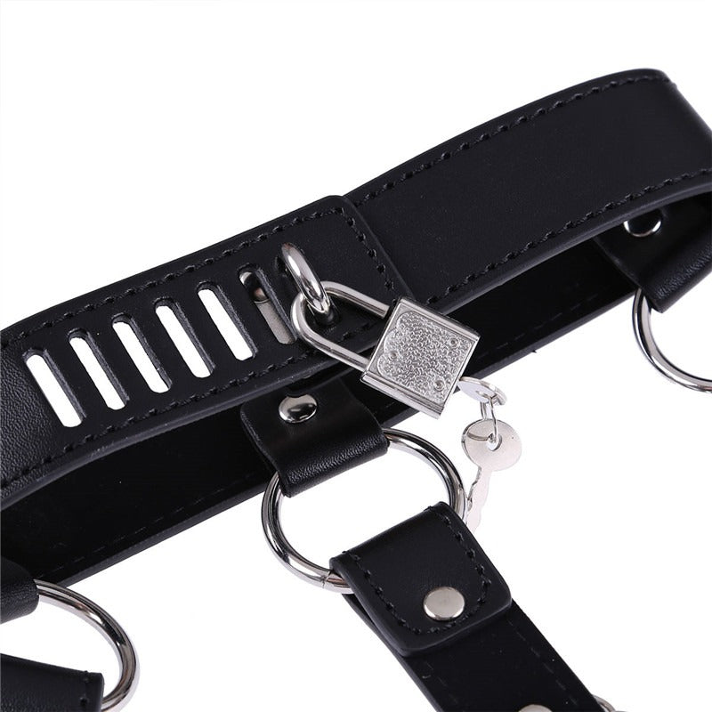 Close-up of a black leather body harness featuring silver chains and a lock, perfect for Gothic fashion.