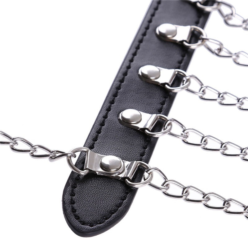 Close-up of a women's Gothic chest harness featuring multiple silver chains and black leather straps.