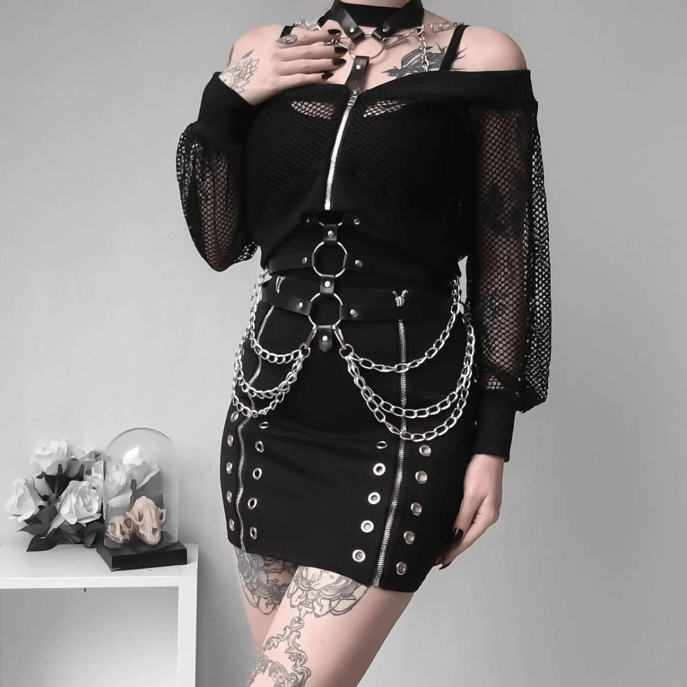 Gothic style body harness with chains, paired with a chic black outfit for a stylish fashion statement.