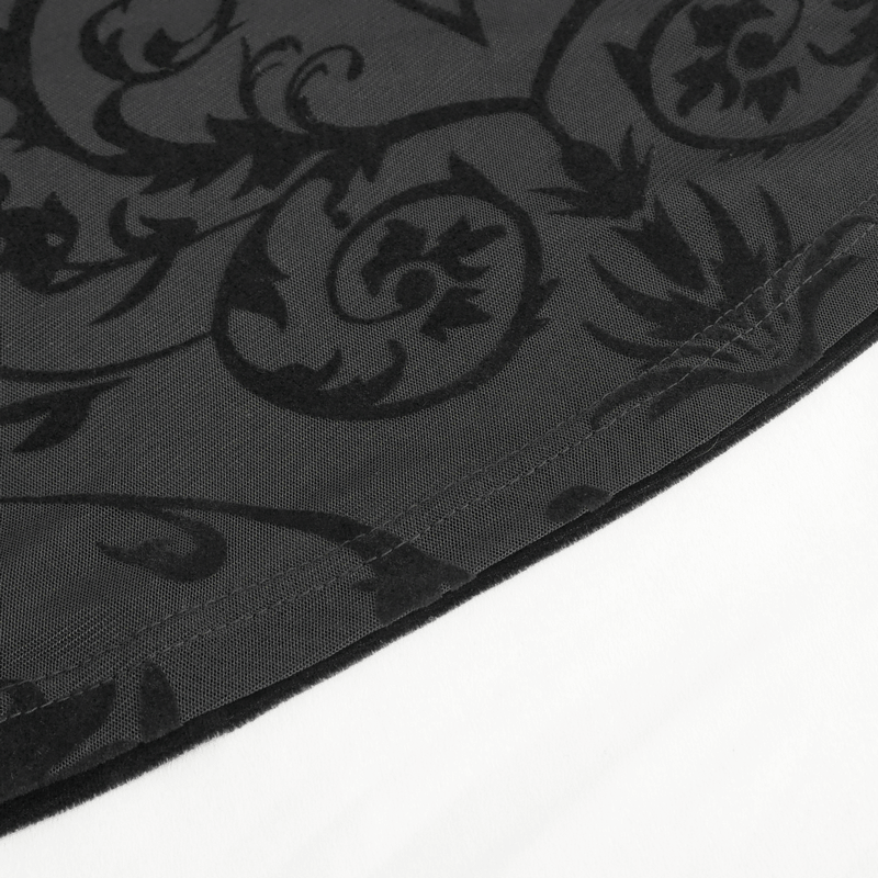 Close-up of vintage floral lace fabric pattern in deep black, showcasing elegant design details.