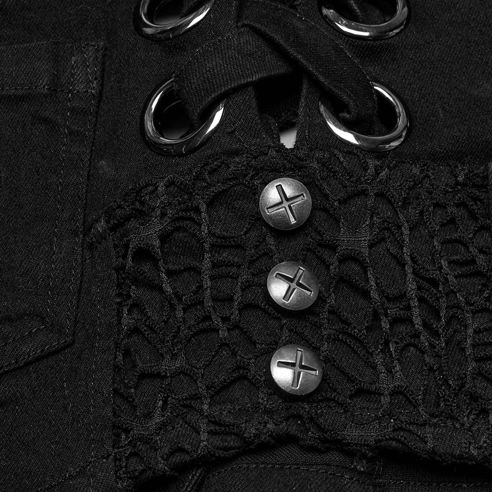 Close-up of punk denim shorts showcasing metal eyelets and decorative buttons for a stylish edgy look.