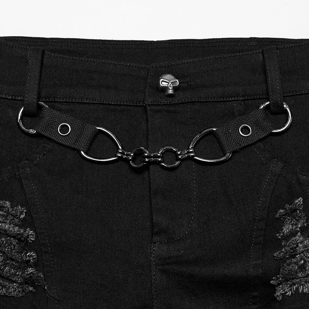 Close-up of sexy denim shorts with detachable chain and metal eyelets, showcasing edgy punk details.