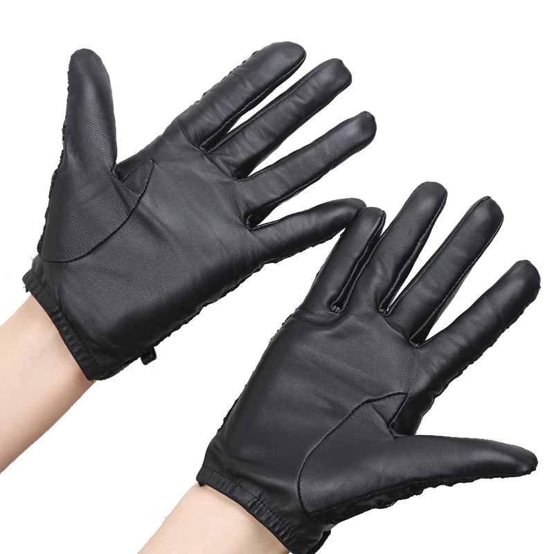 Elegant black genuine leather gloves with delicate design, perfect for adding a classy touch to any outfit.