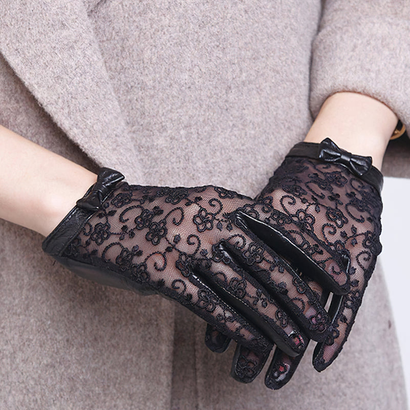 Elegant black lace gloves with bow, perfect for a vintage fashion look at fancy events.