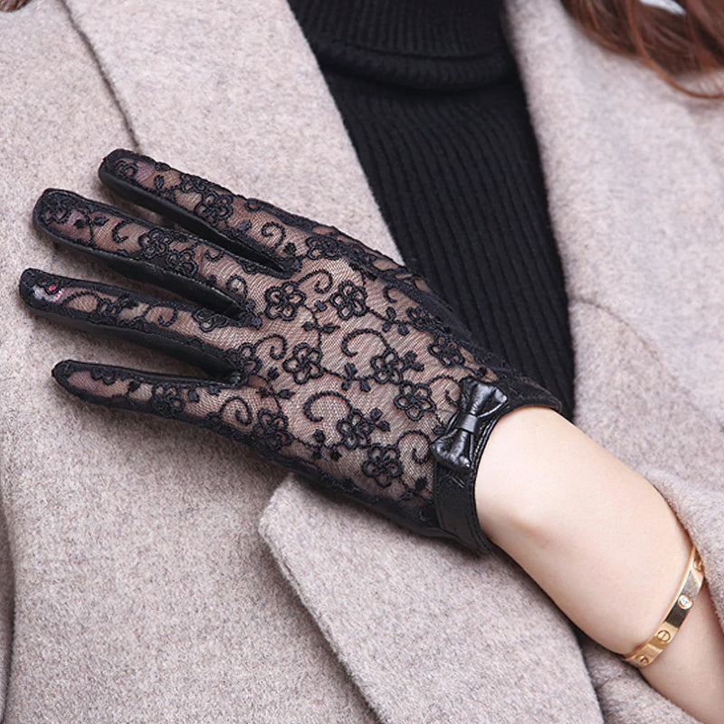 Elegant black lace gloves with bow, showcasing vintage style and flower patterns, perfect for trendy fashion lovers.