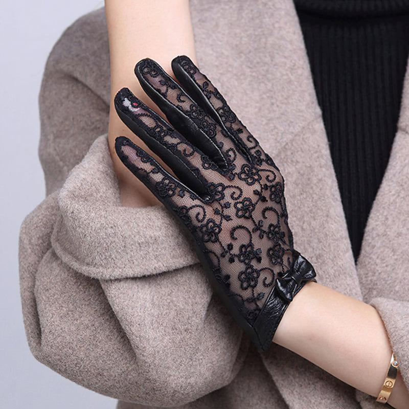 Elegant black lace gloves with bow, perfect for vintage fashion and classy evenings out.