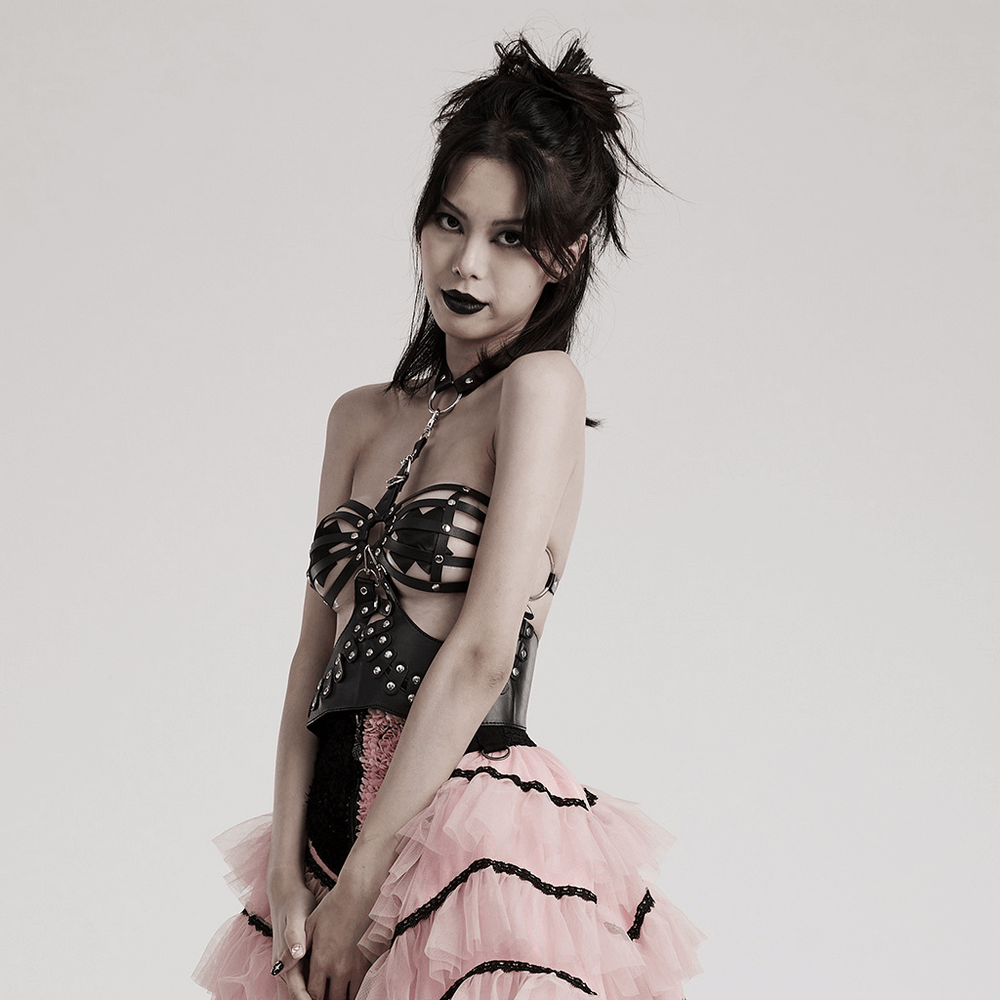 Model wearing a sexy faux leather gothic strapped bustier top with punk style and layered pink skirt.