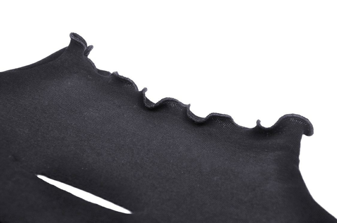 Close-up of sexy black fishnet sweatshirt with edgy ruffled neckline and hollow out design.