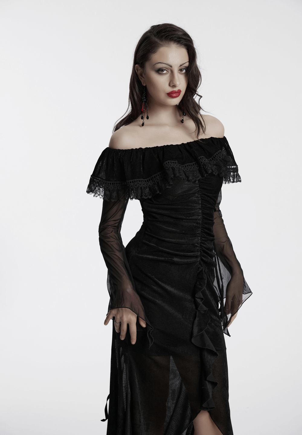 Elegant goth mesh dress with ruffles and fishtail hem, showcasing dark romance and sophistication.