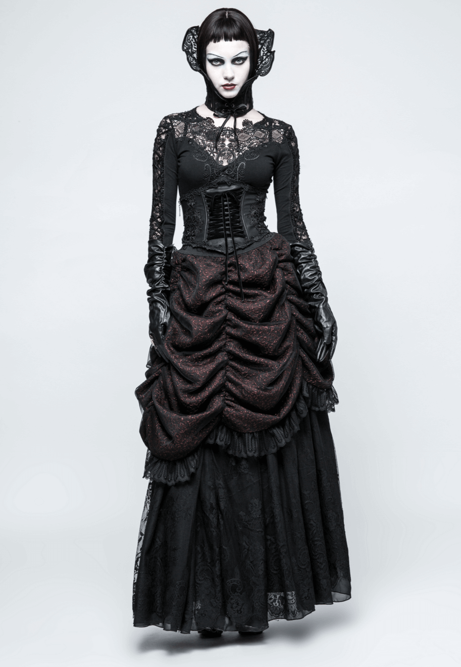 Gothic Victorian woman in black floral corset dress with lace sleeves and elegant gloves, showcasing dark romance style.