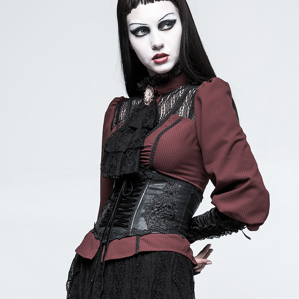 Elegant model wearing a red and black Victorian-style corset with lace detailing, showcasing dark romantic fashion.