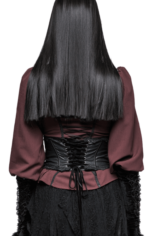 Back view of a model wearing a Victorian-style corset with lacing, paired with a stylish dark ensemble.