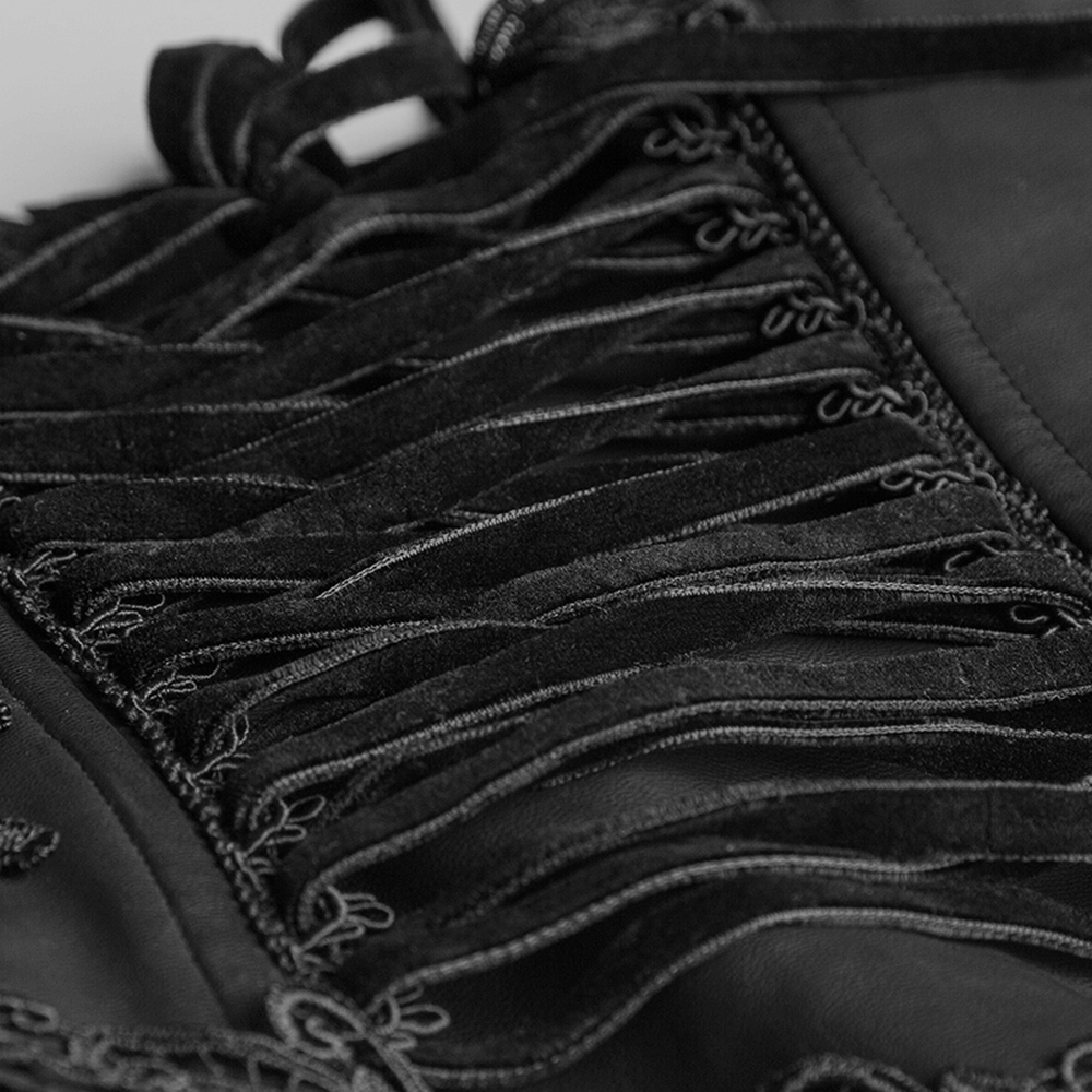 Close-up of black floral embroidered corset detailing with drawstrings and eyelet closure.