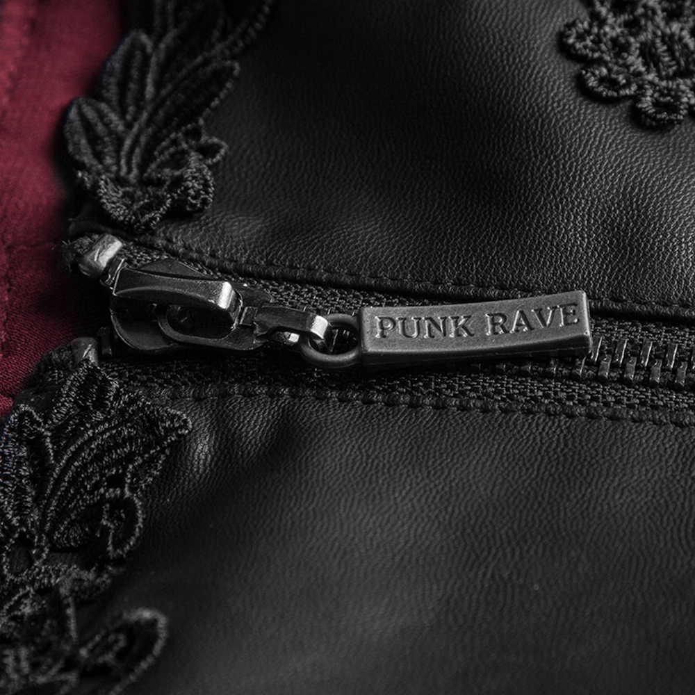Close-up of a Punk Rave corset zipper featuring floral embroidery on black leather.