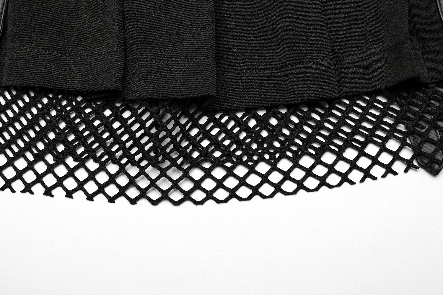 Close-up of a black pleated mesh mini skirt featuring a stylish rubberized woven design with a fishnet hem.