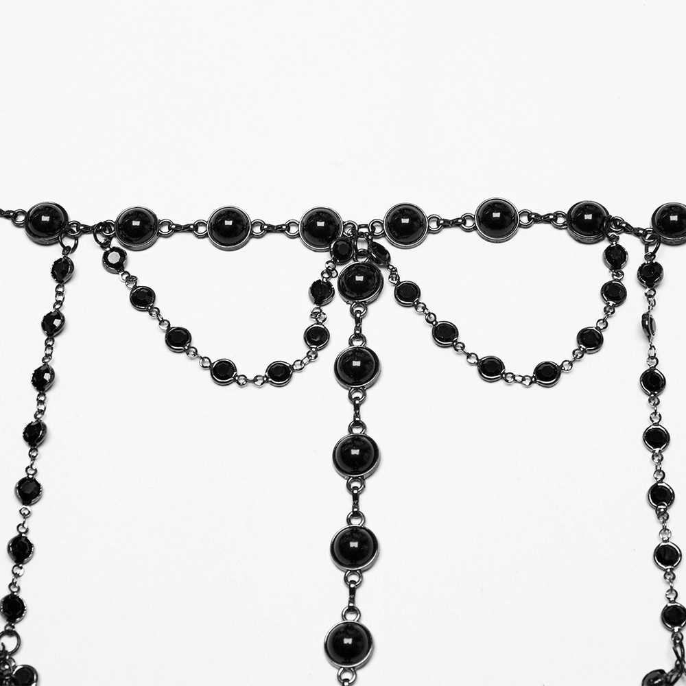 Elegant black beaded chain bra featuring a halter neck design with intricate layering, perfect for gothic fashion.