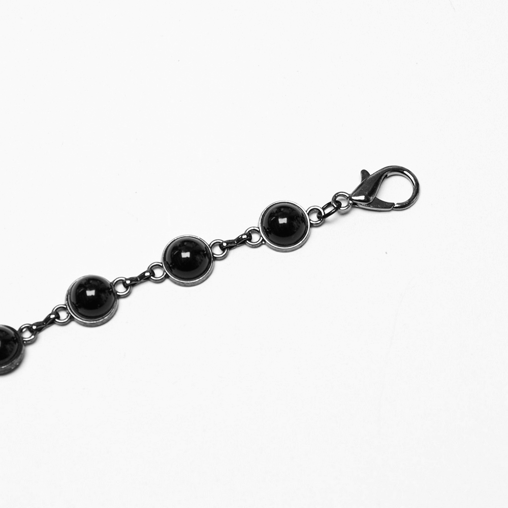 Elegant black bead chain bracelet with a secure clasp, perfect for gothic and bold fashion styles.