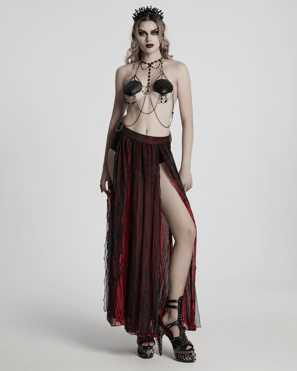 Sexy Gothic Dark Shell Chain Bra with Beads, featuring a dramatic skirt and bold accessories for a striking look.