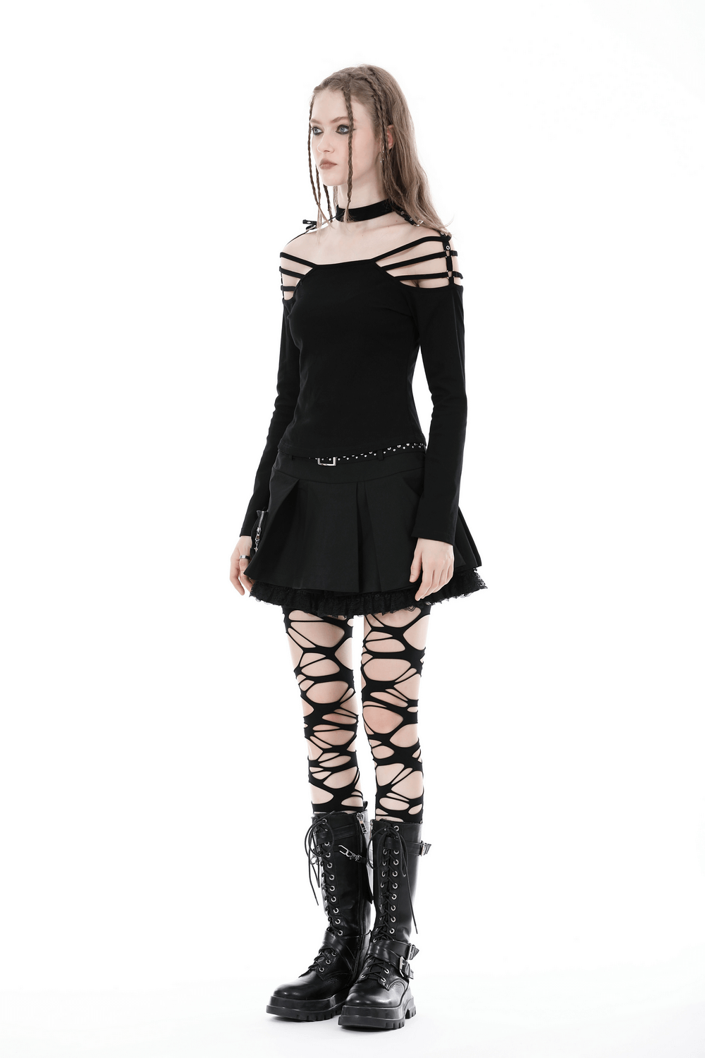 Gothic off-shoulder top with long sleeves, paired with a black skirt and lace-up leggings for an edgy look.