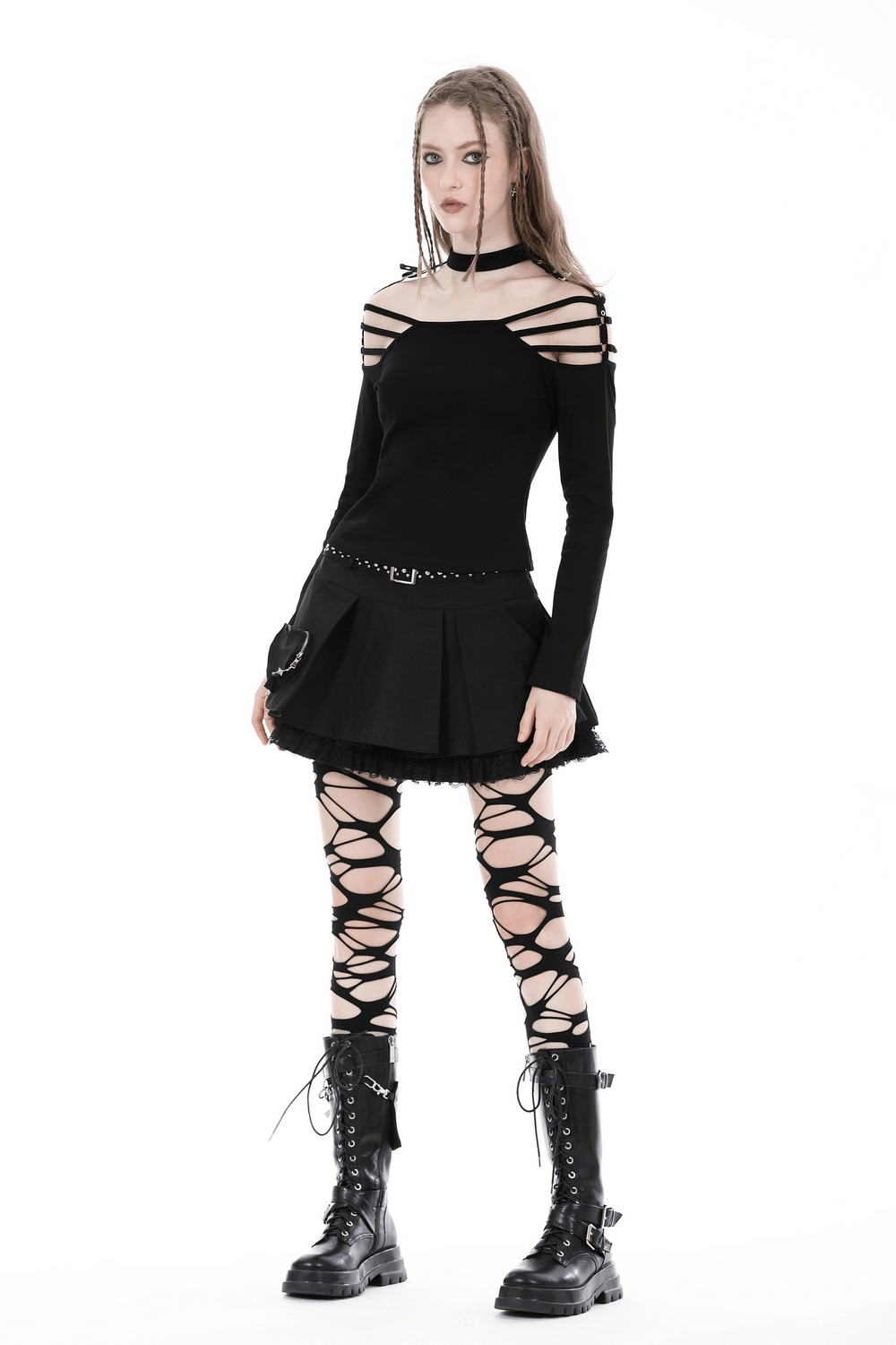 Model showcasing a sexy gothic off-shoulder top with long sleeves, paired with a skirt and lace-up leggings for an edgy look.