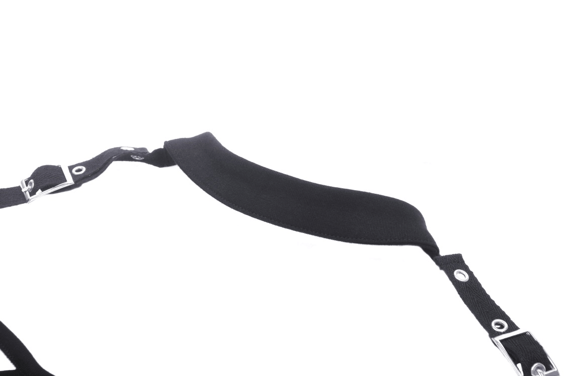 Elegant black harness strap with soft padding and silver hardware for a stylish accessory.