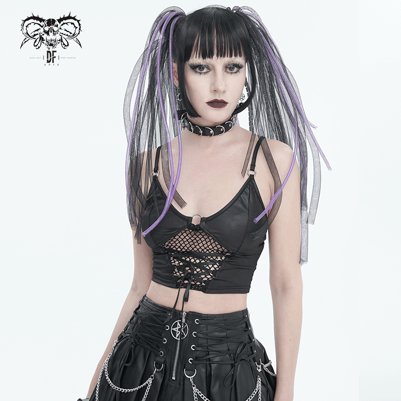 Edgy woman in lace-up grunge crop top with net front and adjustable straps, embodying bold fashion style.