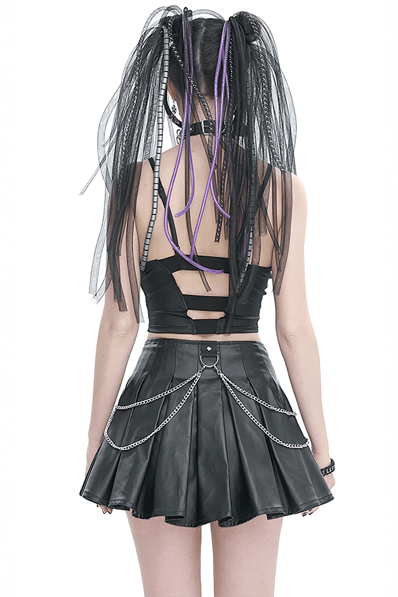Back view of a girl in a black leather camis and skirt with chains, showcasing edgy grunge fashion style.