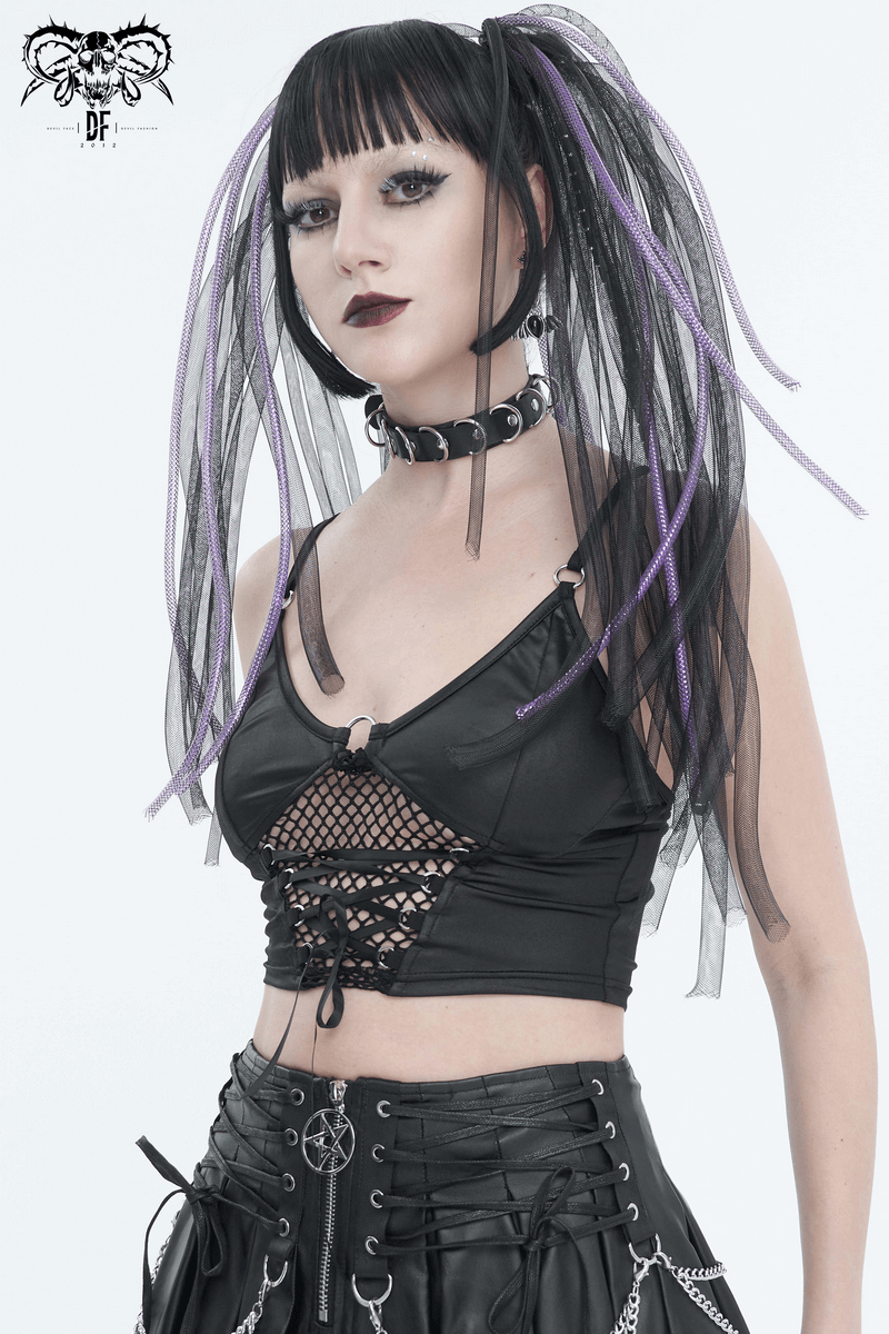 Fashionable woman in black sexy grunge crop top with lace-up net front and edgy accessories, showcasing bold style.