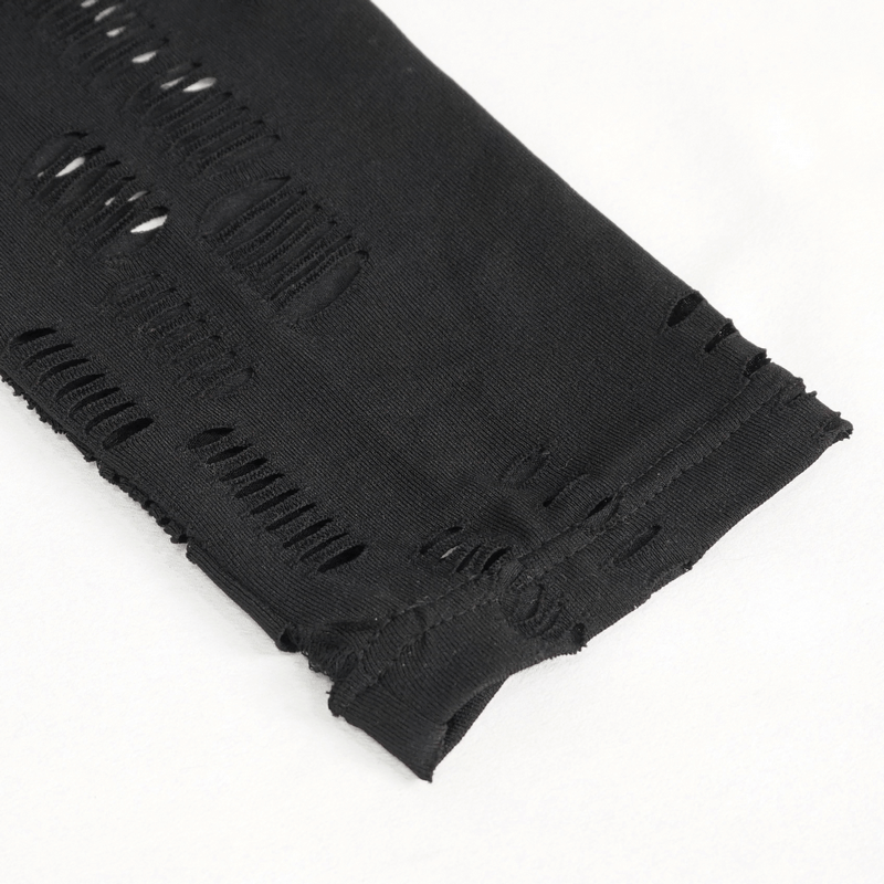 Close-up of sexy black leggings with provocative hole net design and edgy ripped accents.