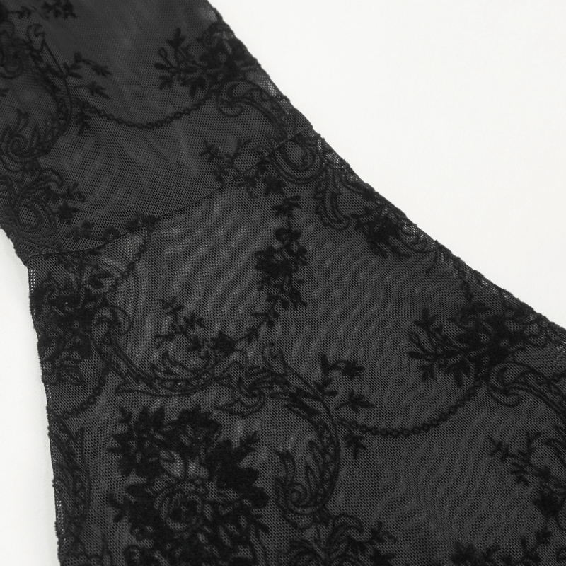 Close-up of elegant black transparent fabric with intricate floral patterns for gothic fashion tops.
