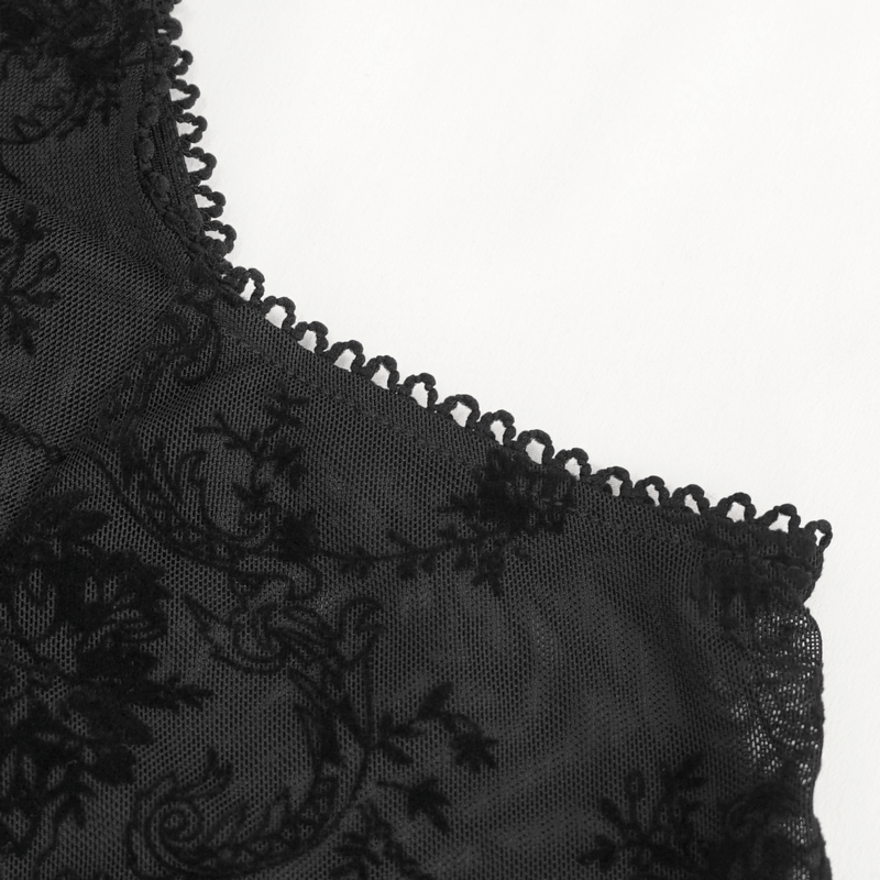 Close-up of gothic women's transparent top with hollow-out shoulder and intricate black lace detailing.