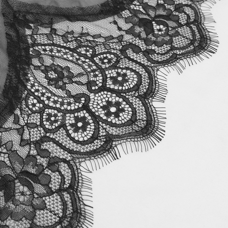 Close-up of exquisite black lace trim showcasing intricate floral patterns for elegant Gothic fashion.