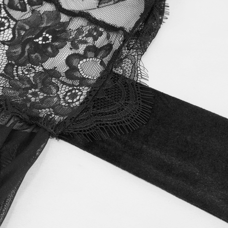 Close-up of elegant black lace fabric with intricate floral design and soft ribbon trim, perfect for a gothic dress.
