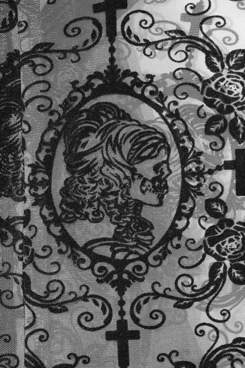 Intricate black lace pattern featuring a skull and floral designs, ideal for gothic fashion enthusiasts.